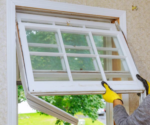 Home repairs, replacement windows. Master removes old window